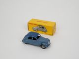 a small blue toy car next to a yellow box