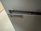 a close up of a metal door with a sign on it