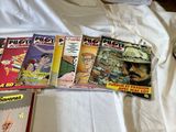 a lot of comic books on the bed