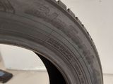 a close up of a tire on a white surface
