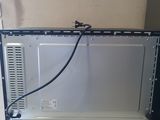 a computer monitor sitting on top of a white desk