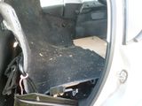 a seat in the back of a car with a bag in it