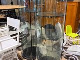 two tall glass vases sitting on top of a table