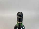 a bottle of wine that is sitting on a table