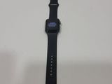an apple watch sitting on top of a table next to a white surface