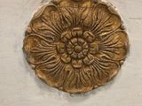 a close up of a decorative object on a wall