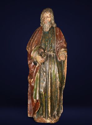 an old statue of a man with a beard and a robe