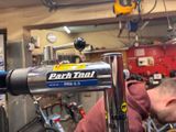a man working on a bike in a bike shop
