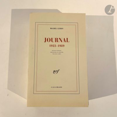the book is sitting on a table with a shadow on it