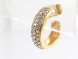 an image of a gold and diamond hoop earring on a clear surface