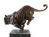 bronze statue of a tiger on a marble base on a white background