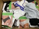 a cardboard box filled with underwear and underwear items