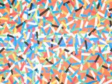 colorful sprinkles are scattered on an orange background