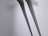 deux fourchettes coupées en deux pour ressembler à une fourchette