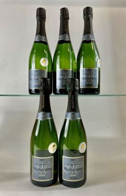 four bottles of champagne are on a glass shelf