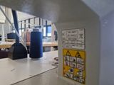 an image of a sewing machine in a factory