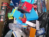 a cardboard box full of electronics and other items