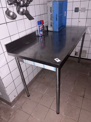 a table with a blue box on it in a kitchen