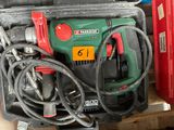 a green and red drill and some other tools in a case