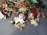 a pile of assorted brooches and other items on the floor