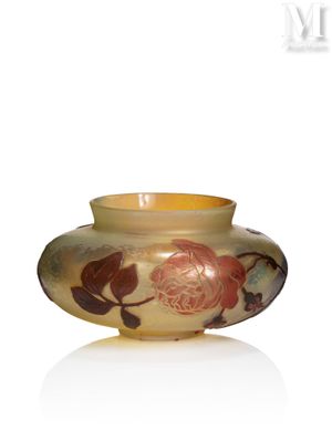 a yellow vase with a floral design on it
