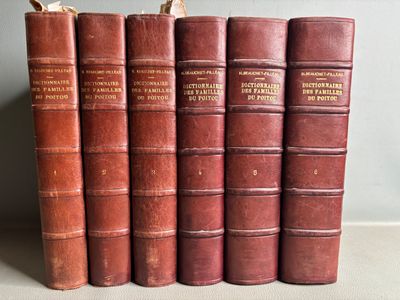 several old books are lined up on a shelf in a row