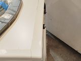 an iron on top of an ironing board on a table