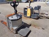 a picture of a forklift sitting in a parking lot