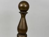 brass ball finition on a wooden base