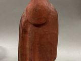 pair of red and gold figurines of a man and a woman