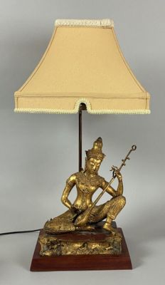 a lamp that is sitting on a table next to a lamp