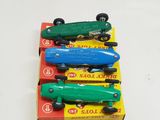 four toy cars that are sitting on top of each other