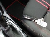 a close up of a car ' s interior with a car key in it