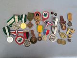 a lot of medals and medals on the table