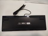 a black laptop with a power cord attached to it