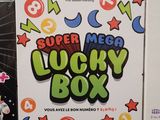 a box of lucky box on the table next to a box of candy