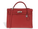 a red leather handbag on a white background