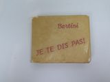 a yellow book with red writing on it sitting on a table