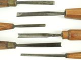many different types of woodworking tools laid out on a white surface