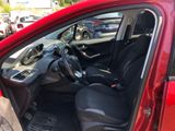 a red car with black seats in the back of it