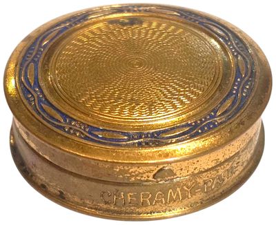 brass plate with a blue border around the edge of it