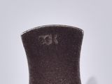 a vase with a top hat on it on a table