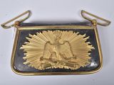 gold and black purse with eagle and sunburst on it