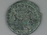 an old bronze coin with a picture of a man on it