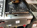 a large frying pan sitting on top of a stove in a kitchen