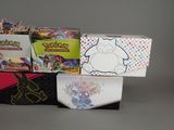 many different types of pokemon cards in the box