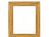 a gold frame on a white wall with a white background