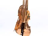sculpture of a violin on a marble base with a white background