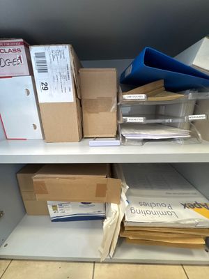 many boxes on the shelves in the room