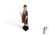 an image of a statue of a man with a hat and robe